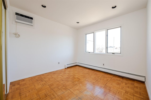 unfurnished room featuring baseboard heating, recessed lighting, a wall mounted AC, and baseboards