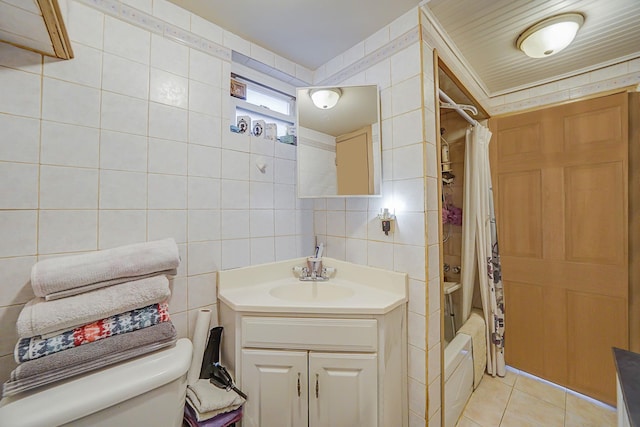 full bathroom with vanity, tile patterned flooring, shower / tub combo, tile walls, and toilet