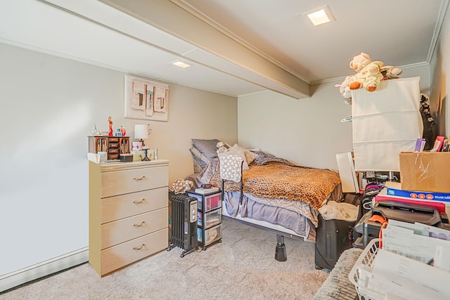 carpeted bedroom with crown molding and baseboard heating