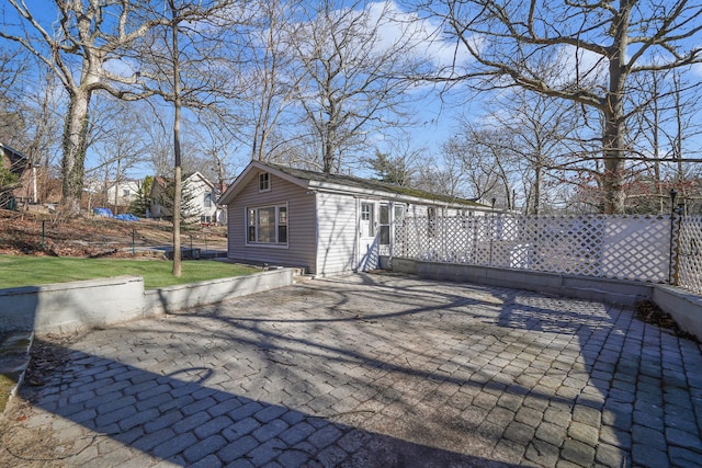 exterior space featuring a yard and fence