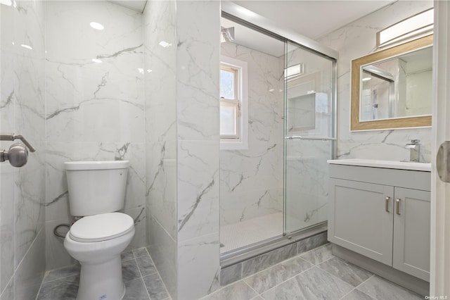 full bath featuring a marble finish shower, toilet, and vanity