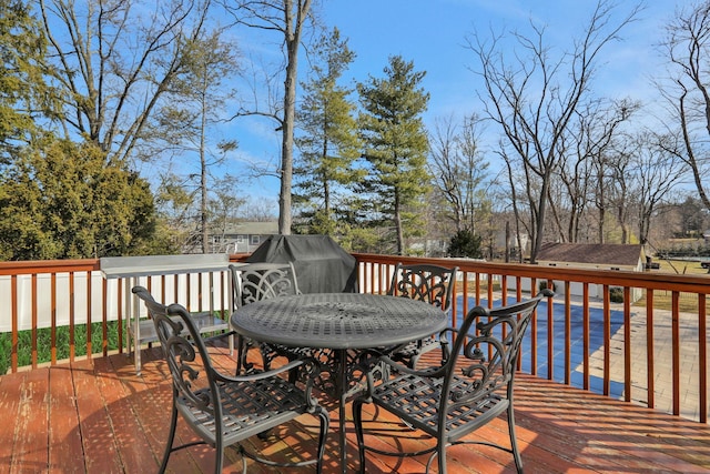 deck featuring outdoor dining area