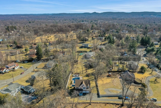 aerial view featuring a mountain view and a wooded view