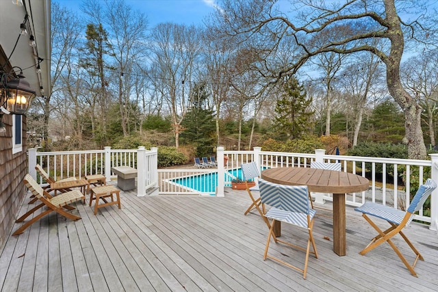 wooden deck featuring an outdoor pool