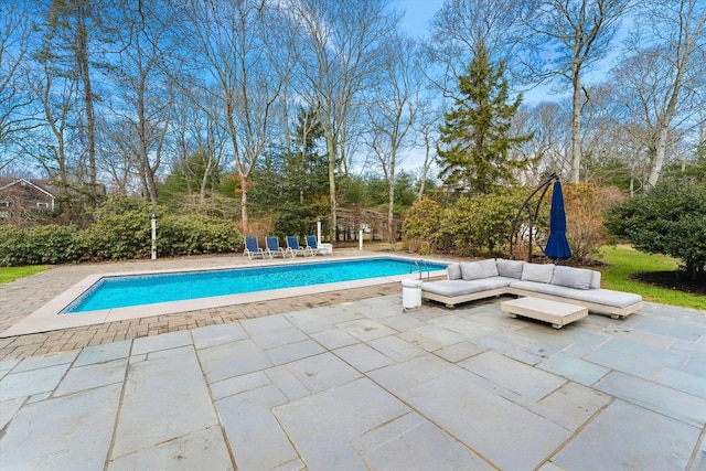 outdoor pool featuring a patio