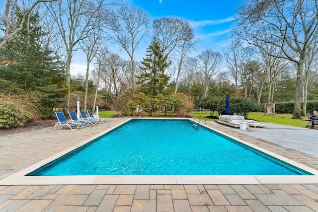 pool featuring a patio area