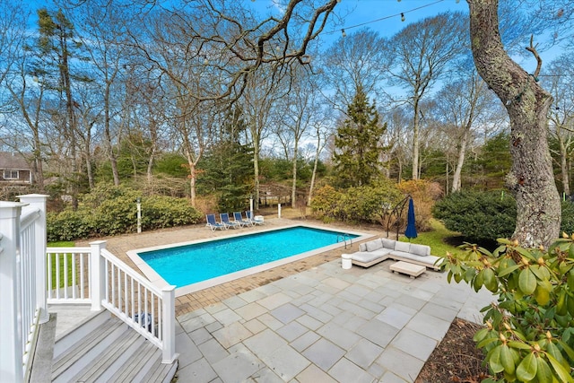 outdoor pool featuring a patio area