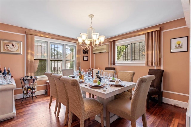 dining room featuring baseboards, a notable chandelier, hardwood / wood-style floors, and a wall mounted AC