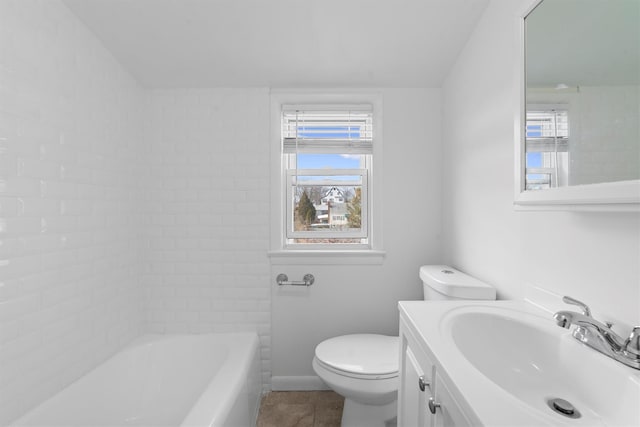 bathroom featuring tile patterned flooring, toilet, and vanity