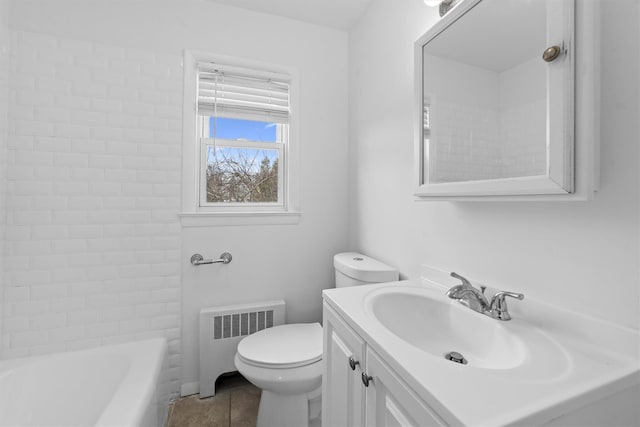 full bathroom featuring toilet, radiator, vanity, and tile patterned flooring