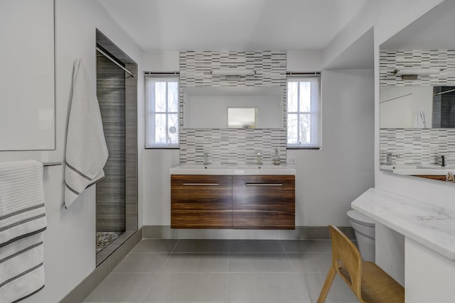 full bath with a wealth of natural light, backsplash, and a shower stall