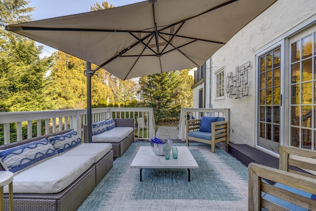 view of patio / terrace with an outdoor living space and a wooden deck