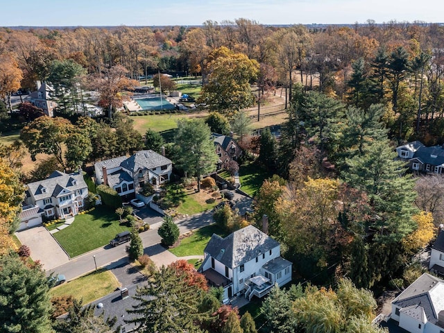 aerial view with a residential view and a wooded view