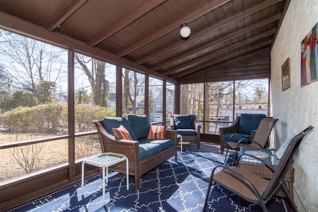 sunroom / solarium featuring wooden ceiling and lofted ceiling with beams