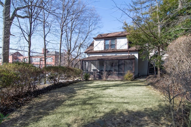 view of yard with a sunroom