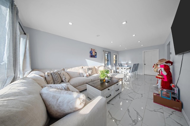 living room with recessed lighting, baseboards, and marble finish floor