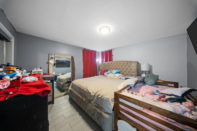 bedroom featuring light wood finished floors