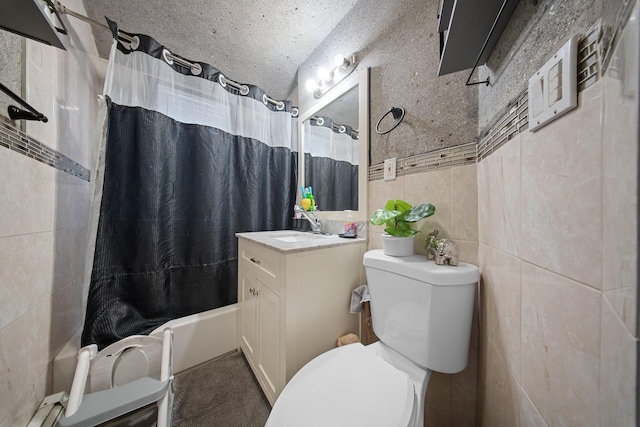 bathroom featuring vanity, tile walls, toilet, and shower / tub combo with curtain