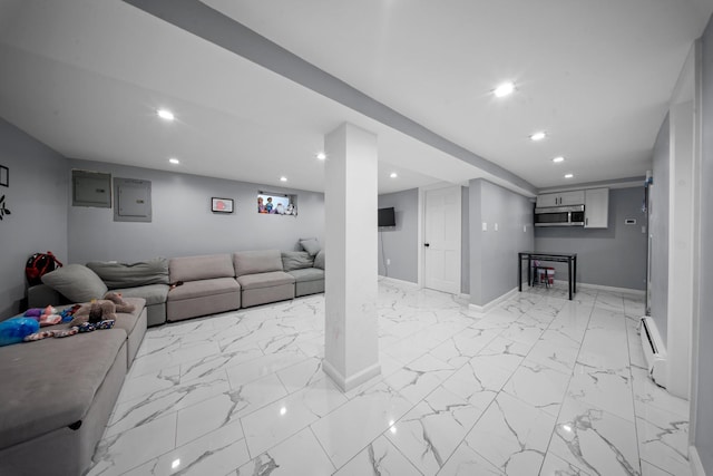 living area featuring recessed lighting, a baseboard radiator, baseboards, and marble finish floor