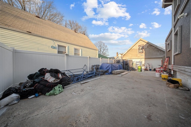 view of parking / parking lot with a fenced backyard