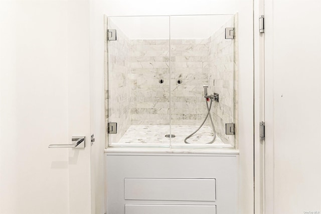 bathroom featuring a shower stall