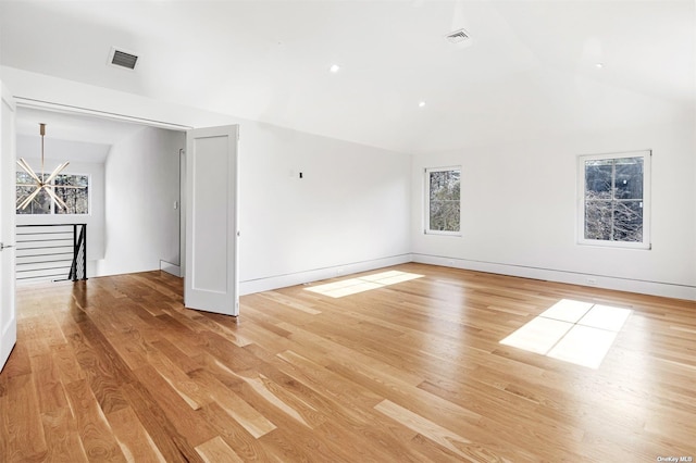 bonus room with visible vents, lofted ceiling, baseboards, and light wood finished floors