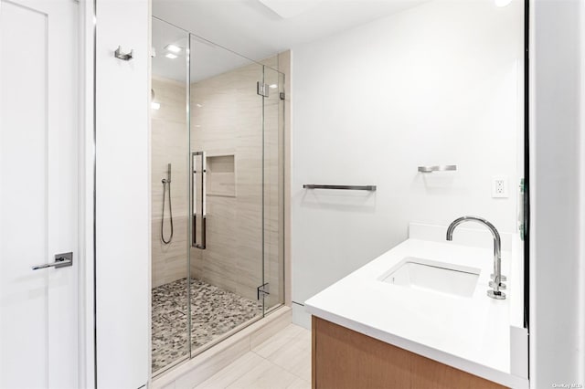 full bathroom featuring a stall shower and vanity