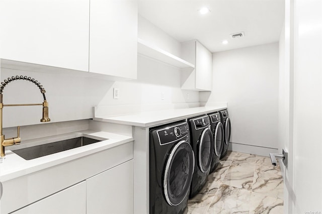 clothes washing area featuring marble finish floor, recessed lighting, cabinet space, independent washer and dryer, and a sink