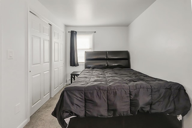 carpeted bedroom with a closet