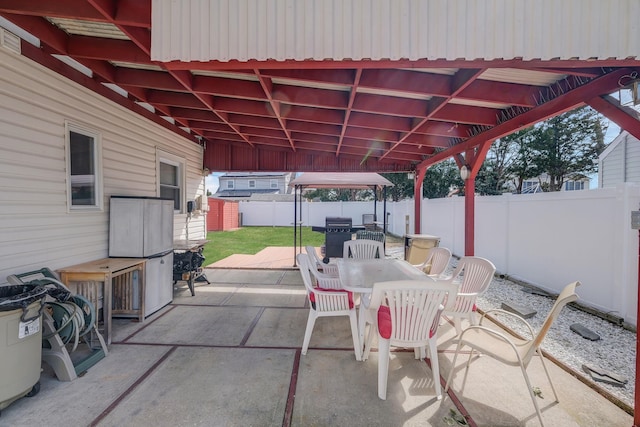 view of patio / terrace with outdoor dining space and a fenced backyard