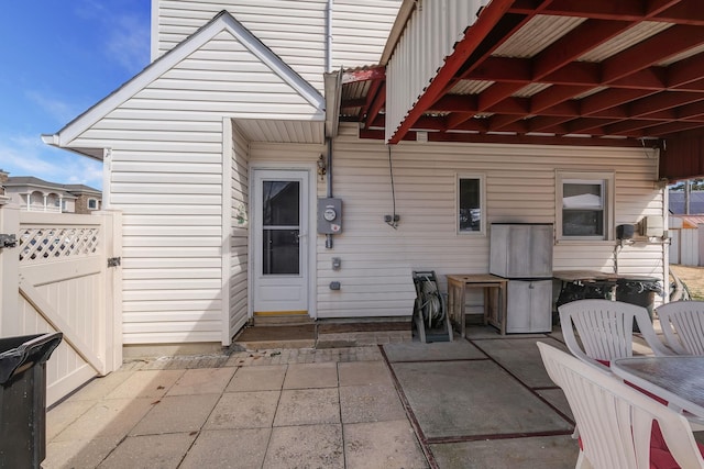 view of patio / terrace with fence and a gate