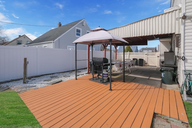 wooden deck featuring a fenced backyard