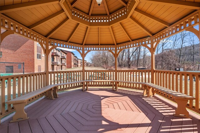 wooden terrace featuring a gazebo