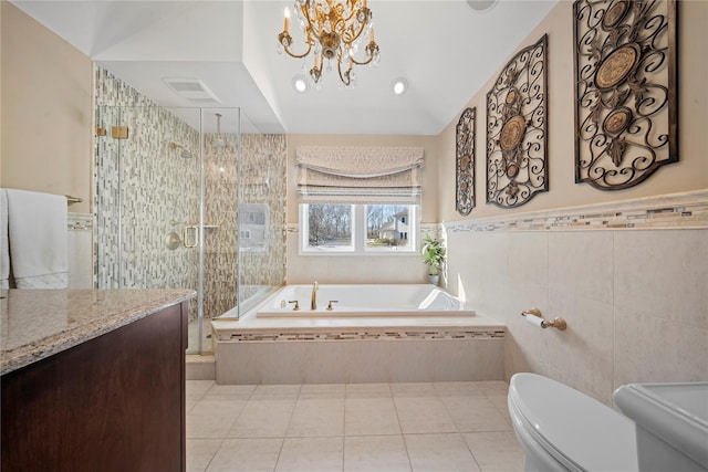 full bathroom with toilet, a stall shower, tile walls, tile patterned flooring, and a bath