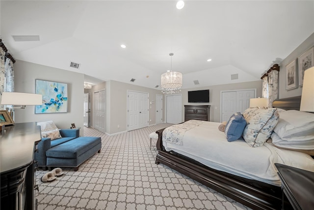 bedroom with recessed lighting, light colored carpet, two closets, and vaulted ceiling