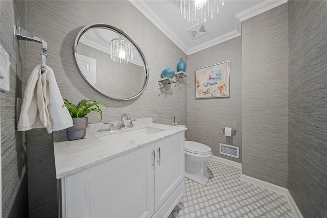 half bath with visible vents, crown molding, toilet, an inviting chandelier, and vanity