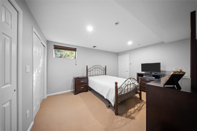 bedroom with visible vents, recessed lighting, light colored carpet, and baseboards