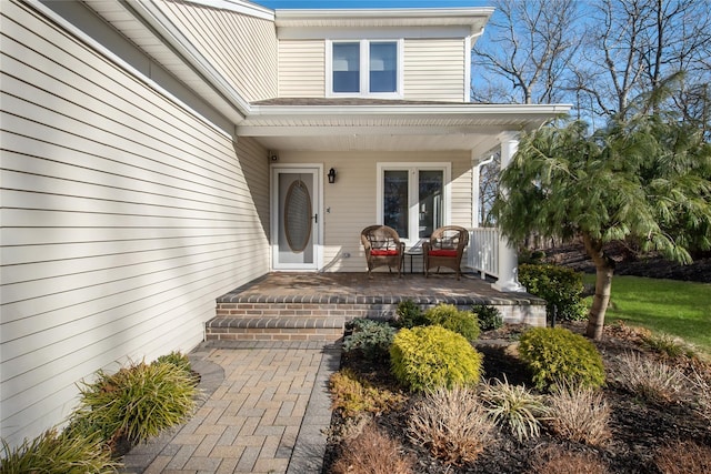 entrance to property featuring a porch