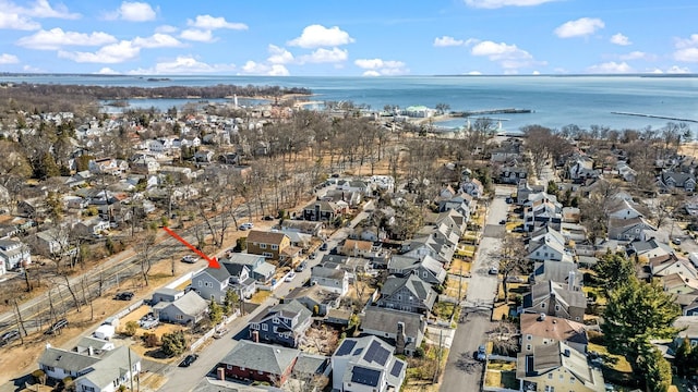 birds eye view of property with a residential view and a water view