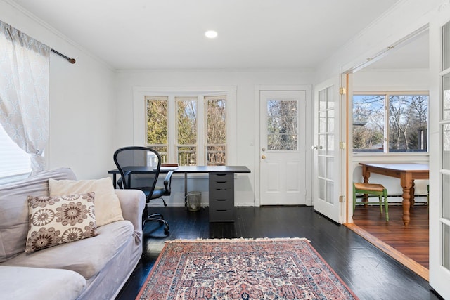 office space with a baseboard radiator, dark wood-style flooring, and ornamental molding