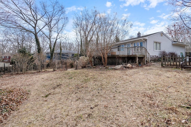 view of yard with a wooden deck