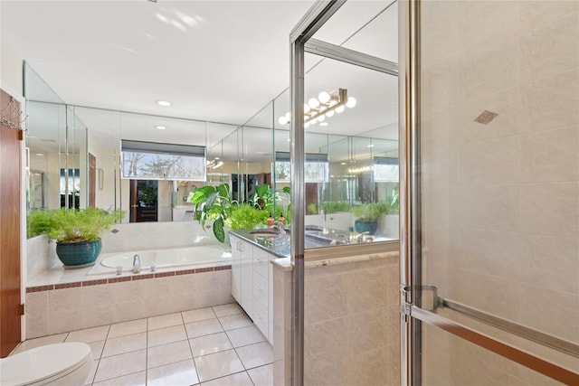 full bath with vanity, a bath, tiled shower, tile patterned floors, and toilet