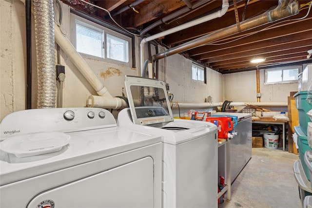 washroom featuring laundry area and separate washer and dryer