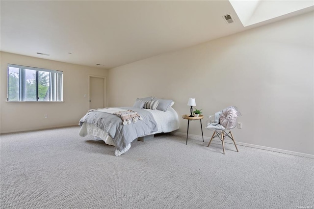 carpeted bedroom with baseboards and visible vents