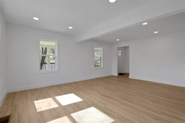 unfurnished room with visible vents, recessed lighting, baseboards, and light wood-style floors