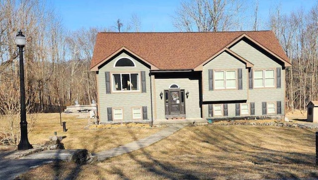 raised ranch featuring a front yard