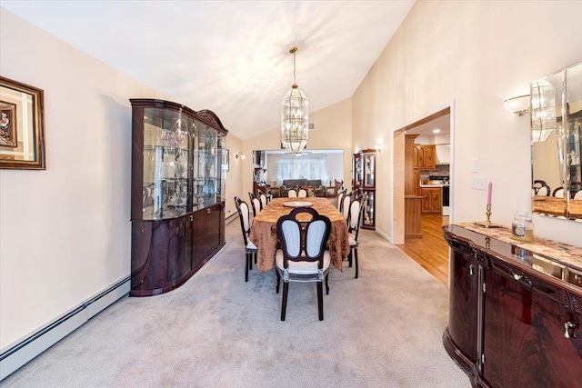 dining area with a baseboard heating unit, light carpet, high vaulted ceiling, and an inviting chandelier