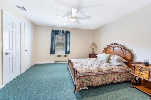 bedroom featuring visible vents, a ceiling fan, radiator heating unit, carpet, and baseboards