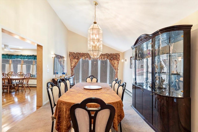 dining space with a baseboard heating unit, baseboards, carpet, a chandelier, and lofted ceiling