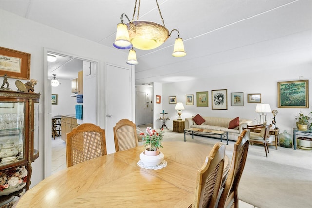 view of carpeted dining space